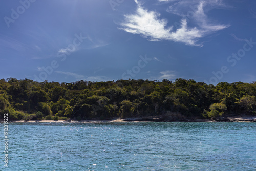 Scenic landscape of the Venezuelan coast in Chuspa, Vargas. View of Playa Caribe featuring rocky outcrops, turquoise Caribbean sea, and the Cordillera de la Costa mountains
