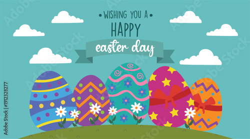 Colorful decorated Easter eggs sit in grass wishing everyone a happy holiday celebration