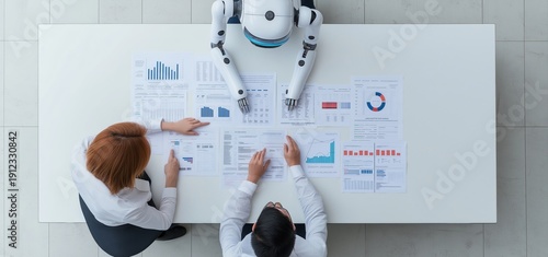 Robot and two business professionals collaborating, reviewing financial data on documents during a meeting, with copy space