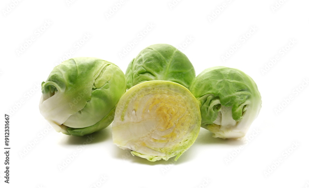 Fototapeta premium Half brussels sprouts raw isolated on white background, side view