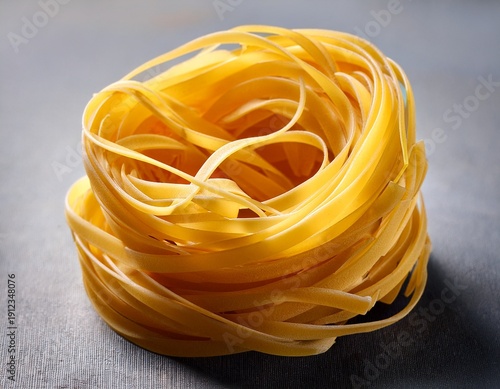 nest of bright yellow pasta strands