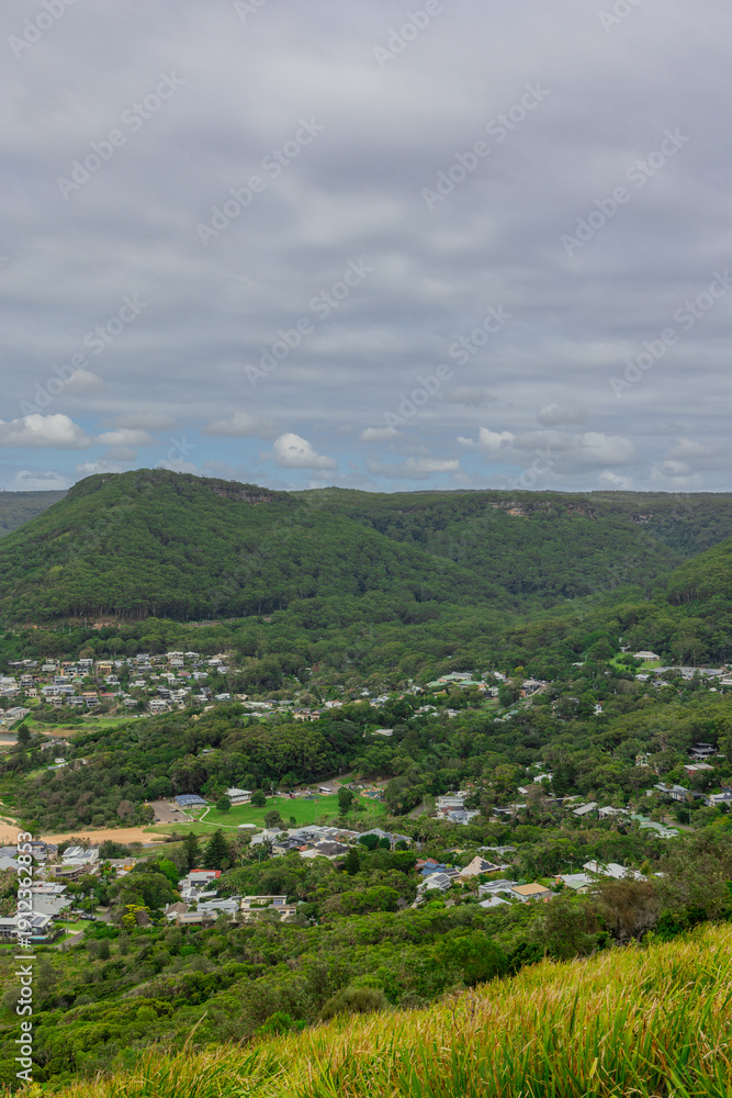 Fototapeta premium Sea Cliff Bridge on the southern coast of Sydney with sweeping Ocean Views and Mountain terrain. a major Bridge Road on the beautiful Australian coastline 