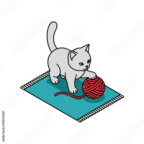 Playful kitten playing with red yarn on a blue rug.