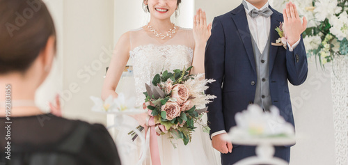 Foto Bride and groom getting married in a church or chapel (ring exchange and ring pr