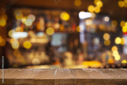 Photos Empty wooden bar countertop against blurred shelves with alcohol