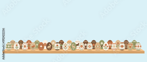 Panoramic vector banner illustration of a set of decorated Easter eggs lined up on a wooden shelf. Rustic folk art style with floral and bunny patterns in earthy tones on a light blue background.