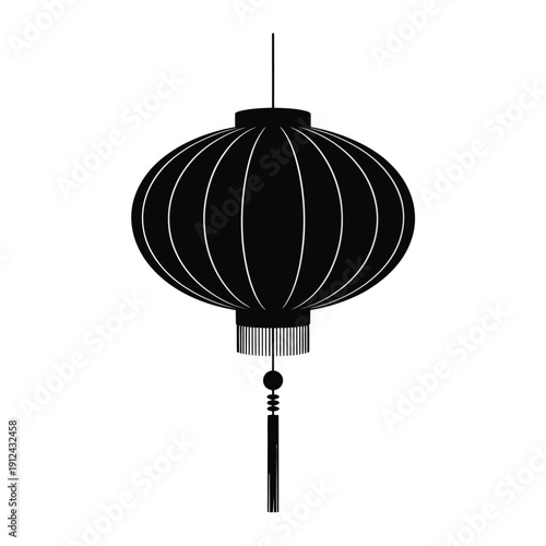 A black paper lantern with vertical ribs and a decorative tassel