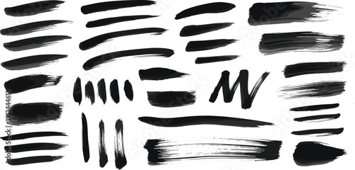 Collection of various black brush strokes and strokes set against a clean white background from a frontal viewpoint