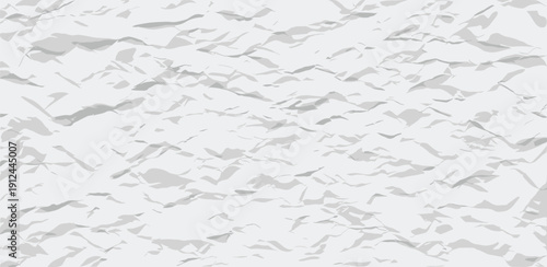 Crumpled paper texture viewed from above, showcasing irregular folds and creases in a detailed, high-contrast image.