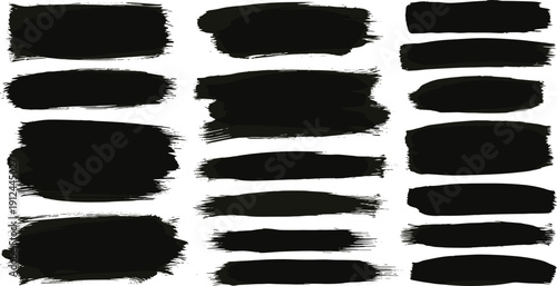 Collection of black brush strokes arranged in a grid pattern on a clean white background viewed from directly above
