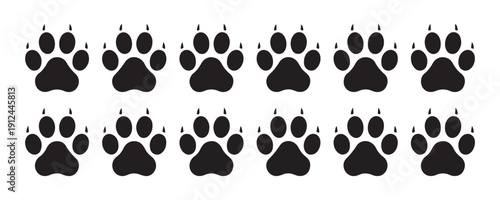 Multiple sharp, black wolf paw prints in two rows, perfect for wildlife and nature-themed designs