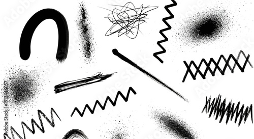 black brush strokes ink splatters and abstract grunge textures on a clean white background perfect for graphic design elements.