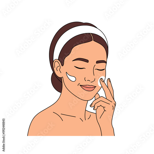 Woman applying cream to her face with a cotton pad on white background