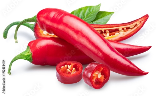 A vibrant arrangement of red chili peppers including whole and sliced specimens on a white background