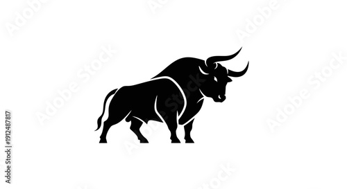 Silhouette of a powerful bull standing strong.