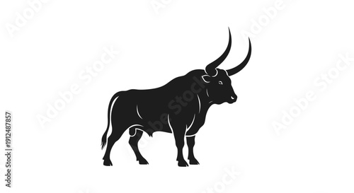 Silhouette of a powerful bull with large horns.