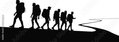 Silhouette of a group of diverse hikers with backpacks walking in a line along a winding mountain path at sunset