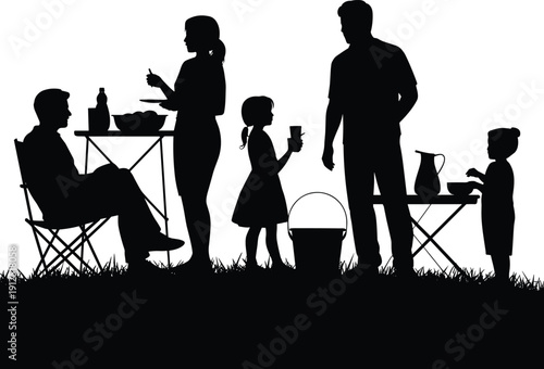 Silhouette of happy family enjoying outdoor picnic dinner with children and parents eating at tables in grass for summer concept