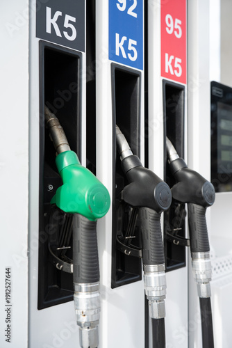 Vertical shot of The Fuel Pump Nozzles at an Urban Gas Station . K5 is an environmental class of fuel indicating low sulfur and harmful impurity content.