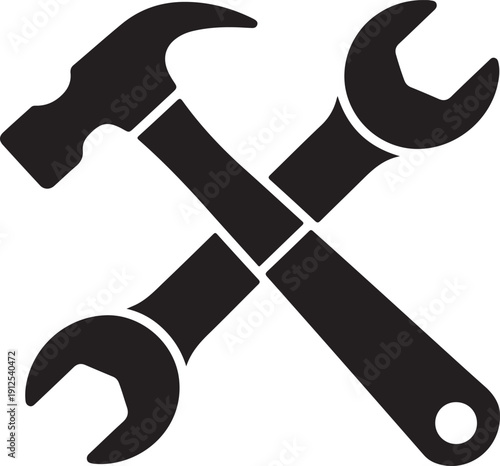 A classic hammer and a wrench are crossed over each other symbolizing repair and maintenance tasks