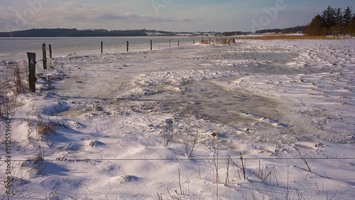Frozen Danish Fjord Under Blue Sky