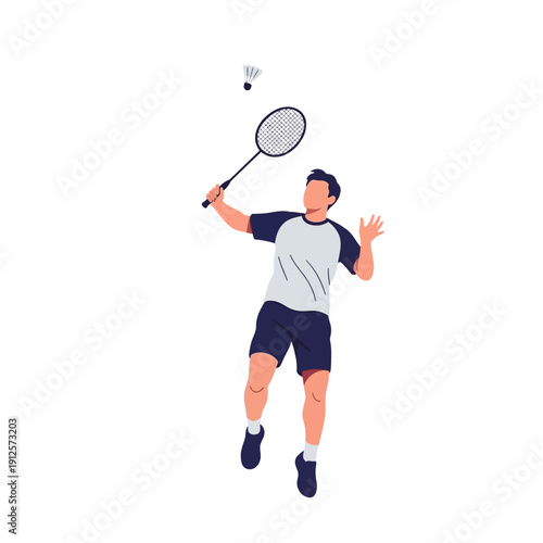 Man playing badminton, jumping and hitting shuttlecock with racket, sports action shot