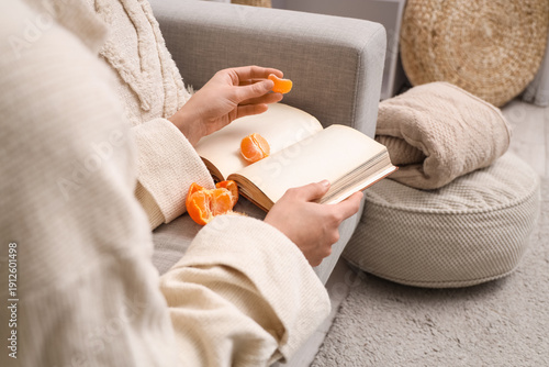 Young woman reading book an...