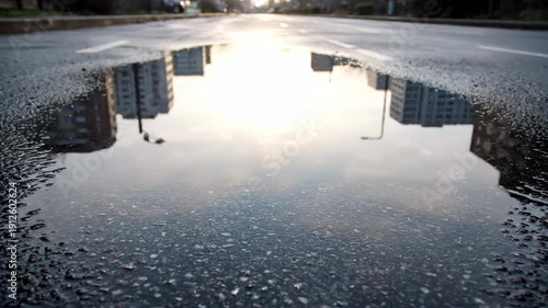 Wallpaper Mural Reflection of City Buildings in a Puddle on a Wet Road. Torontodigital.ca