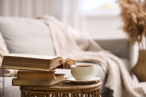 Stack of books and cup of c...