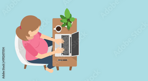 Woman working on laptop in a comfortable chair with a cup of coffee.