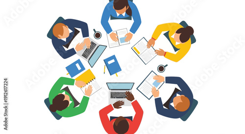 Group of people collaborating around a circular table with laptops and documents.