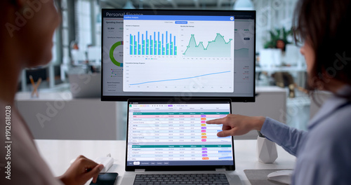 Photos Women Analyze Financial Data Using Spreadsheets And Charts