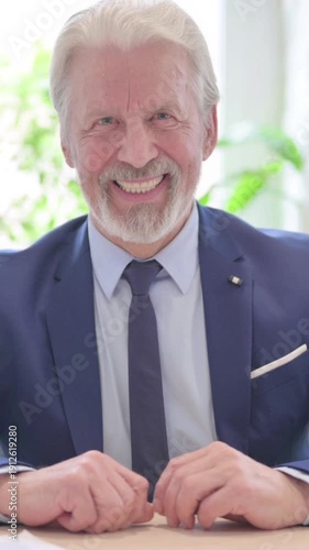 Smiling Senior Old Businessman Looking at Camera, vertical video