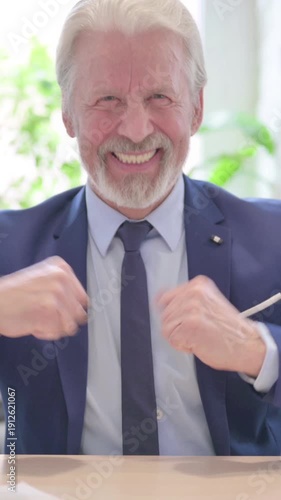 Confident Senior Old Businessman showing Thumbs Up, vertical video