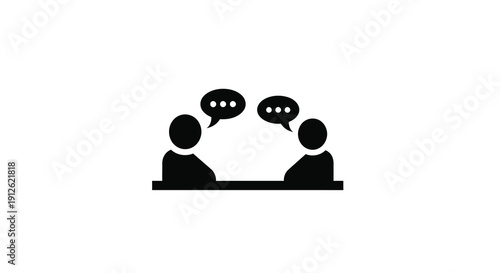 Two people in conversation represented as a stark silhouette