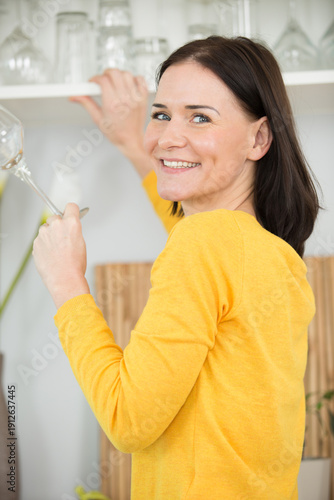 Konstfotografi a beautiful woman cleaning cupboard
