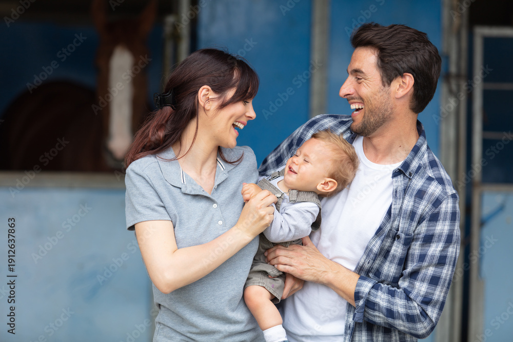 Obraz premium happy young family going for a walk in forest