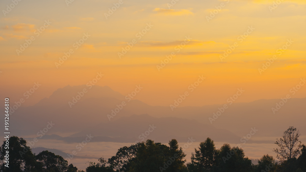 Obraz premium sunrise with moving of cloud and clear sky and layer of mountain