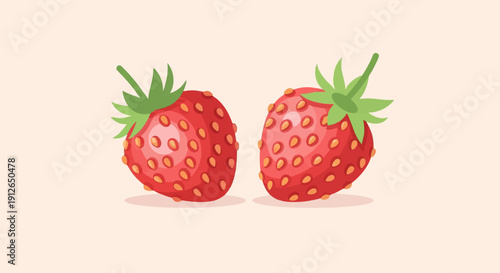 Two bright red strawberries with green tops on a pale background
