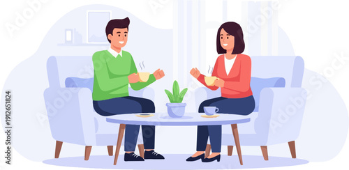 Two smiling people relax on chairs, holding coffee cups