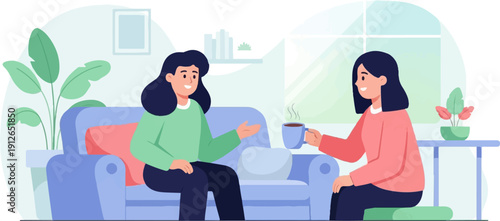 Two women enjoying a conversation and a warm drink in a cozy living room