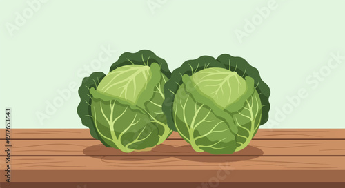 Two fresh green cabbages sit on a wooden surface