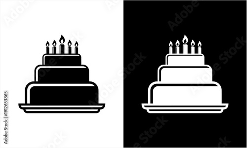 Two-tiered birthday cake with lit candles in black and white.