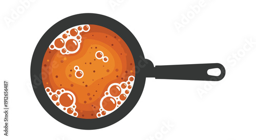 Vibrant Orange Liquid Boiling in a Frying Pan Illustrating Culinary Preparation and Kitchen Activity