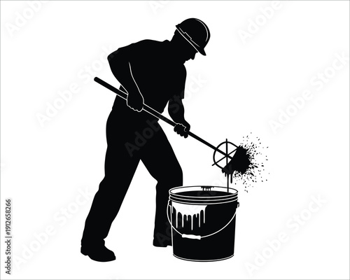 Worker in silhouette stirring a bucket with a long tool