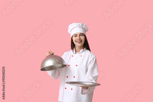Female chef with silver tra...