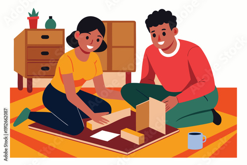 Young couple sitting on the floor and assembling furniture