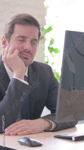 Tired Young Businessman Sleeping at Work, vertical video