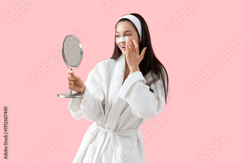 Young woman with nose patch...