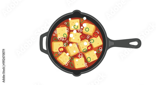 Spicy tofu stew simmering in a skillet, adorned with green onions and chili. This hot, comforting dish is presented beautifully with fresh